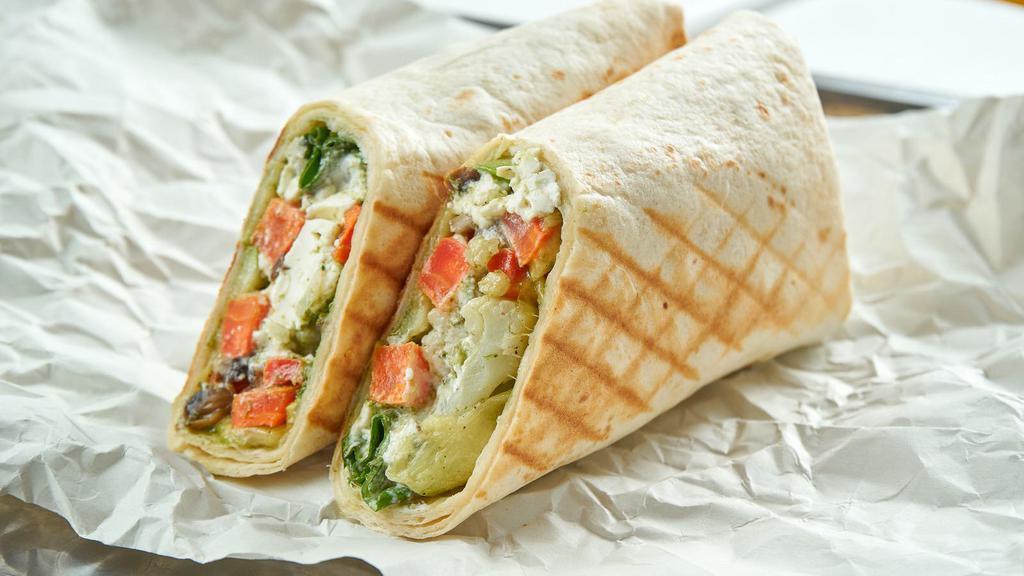 Grilled Chicken Chipotle Wrap · Juicy grilled chicken, jack cheese, avocado, onions, mixed greens, and chipotle mayo folded into wrap of choice and served with choice of side.