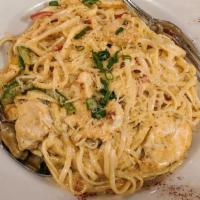 Spicy Cajun Chicken Pasta · Tender chicken white meat, bell peppers with our housemade Cajun sauce over pasta.