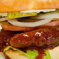 Nashville Hot Crispy  Chicken Burger · Chicken Tenders, Lettuce, Onions, Tomatoes, Pickles, Nashville  Hot Sauce, Mayo, Toasted Bun