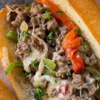 Philly Cheese Steak Sandwich · Philly steak, sauteed mushrooms, onions, bell peppers with American cheese over a French roll.