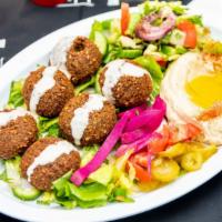 Falafel Plate · Six pieces. Chickpeas and fava beans mixed with herbs, garlic, onion, sesame seeds and speci...