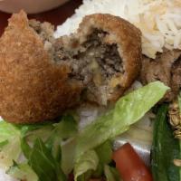 Kibbeh · Four pieces. A shell of bulgur wheat and beef stuffed with ground beef, onion and special sp...