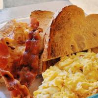 The Alarm · Two eggs, hash browns, toast, with either bacon or sausage.

NOTE: Only available during bre...