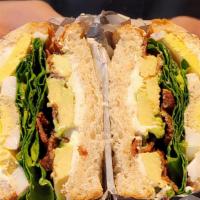Sunshine Sandwich · Bacon, avocado, hard-boiled egg, spinach, tomato, with a light cream cheese spread.