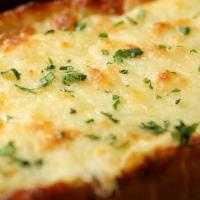 Get That Cheesy Garlic Bread · (Vegetarian) Housemade bread toasted and garnished with butter, garlic, mozzarella cheese, a...