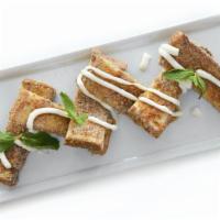 French Toast Churros · French brioche, cinnamon, sugar, cornflakes, fresh mint, vanilla glaze.