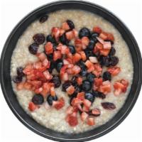 Vegan Steel Cut Oatmeal · Organic oatmeal, fresh berries, and
dried cranberries.