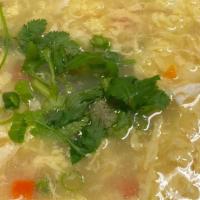 Egg Drop · Fresh egg cooked with ground chicken pea carrot green onion in a light broth.