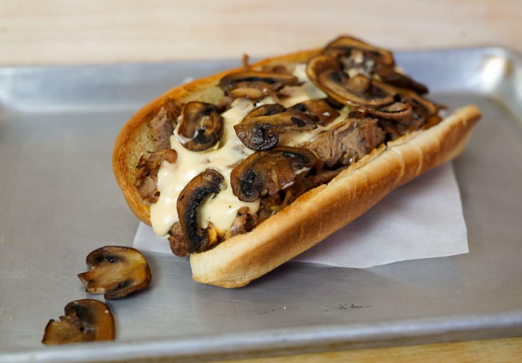 Mushroom Cheesesteak · 8” Philly cheesesteak loaded with grilled steak, melted cheese and savory grilled mushrooms on a toasted hoagie roll