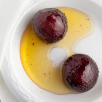 Gulab Jamun · Cheese ball dipped in sugary syrup.