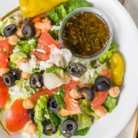 Italian Salad · Lettuce, Red Cabbage, Garbanzo Beans, Black Olives, Shredded Mozzarella, Tomatoes & Pepperon...