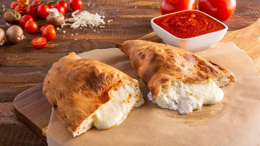 Ricotta & Mozzarella Calzone · Our classic calzone, made with ricotta and mozzarella cheeses inside a pocket of pizza dough.
