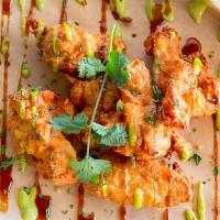 Nk Chicken Wings (6 Pieces) · Crispy deep-fried wings drizzle with sauce.