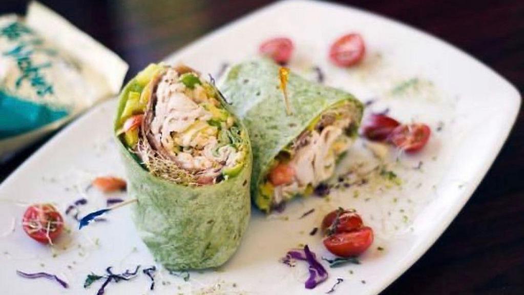 Greek Wrap · Grilled chicken, kalamata olives, romaine lettuce, pepperoncini, cucumbers in a spinach wrap with a tzatziki sauce.