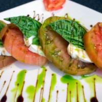 Caprese Salad · Small. Fresh mozzarella, vine ripened tomatoes, and basil leaves with garlic infused olive o...
