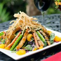Asian Salad · Teriyaki chicken, spinach, peppers, oranges, crisp wontons, purple coleslaw, and ginger snap...