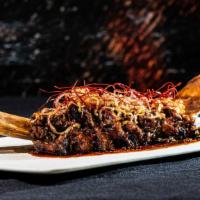 Tomahawk Short Ribs · Served bone-on, Grilled and served with Yakiniku BBQ Sauce