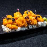 Rock Shrimp Tempura  · Tempura rock shrimp tossed in a creamy, spicy sauce over a spicy tuna roll.