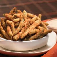 Crispy Green Beans · Onion-battered green beans fried to a crisp, golden brown and seasoned with Cajun spices. Se...