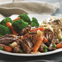 Braised And Slow-Roasted Pot Roast · Tender beef sautéed with fresh mushrooms in a demi-glace red wine beef sauce, with carameliz...