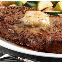 New York Strip Steak  · Seasoned & seared 10 ounce steak with roasted garlic butter, loaded mashed potatoes and spri...