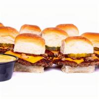 Impossible™ Sliders (9) · griddled impossible patties, with steamed onions, dill pickle, melted American cheese on but...