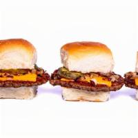 Impossible Sliders (3) · griddled impossible patties, with steamed onions, dill pickle, melted American cheese on but...
