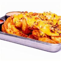 Loaded Twisty Fries · loaded twisty fries melted American cheese, caramelized onions & a choice of two dips