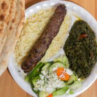Shami Kabob · Skewer of ground beef mixed with onions and tomatoes and herbs, grilled over flame.