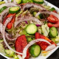 Shirazi Salad · Diced tomato, onion, cucumber with lemon juice and olive oil dressing.