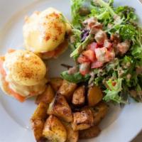 Eggs Benedict · Brioche toast, organic eggs poached and hollandaise sauce served with salad and sautéed pota...