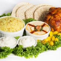 Family Meal · One whole rotisserie chicken, two small 8 oz. sides, rice, two sauces, and six pita breads.