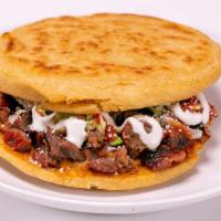 Gordita · Thick tortilla top and bottom, with choice of meat, lettuce, sour cream, beans, lettuce, che...
