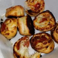 Pizza Rolls · Pepperoni-bacon-cheese or Spinach-artichokes- cheese both come with choice of marinara or ra...