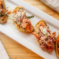 Bruschetta · Toasted bread with tomato, onion, garlic, basil and olive oil.