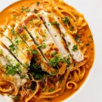 Fettuccine Michaelangelo · Sliced chicken breast and sun-dried tomatoes in a tomato and cream sauce.
