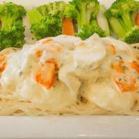 Pollo Rosamarina · Chicken topped with potatoes covered with a savory cream sauce.