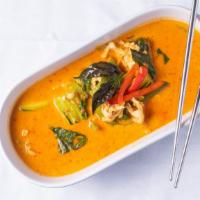 Red Curry · Red coconut milk with bamboo shoots, bell peppers & basils.