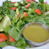 Fresh Green Salad · Vegan, gluten-free. Fresh romaine lettuce, cucumber, and tomato, with homemade cumin cilantr...