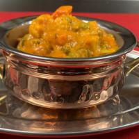 Vegetable Korma · Gluten-free. Mixed vegetable cooked with cooked in fresh tomato, onion, ginger, garlic, saff...