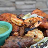 Tandoori Mixed Flavor (For One) · An assortments of chicken tikka, tandoori chicken, seekh kabob, lamb boti, and tandoori shri...