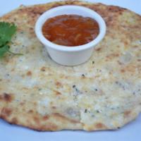 Cheese Naan · Naan stuffed with paneer served with a side of fruit chutney.