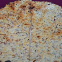 Aloo Paratha · Whole-unleavened bread filled with spiced mashed potatoes, served with mint chutney.