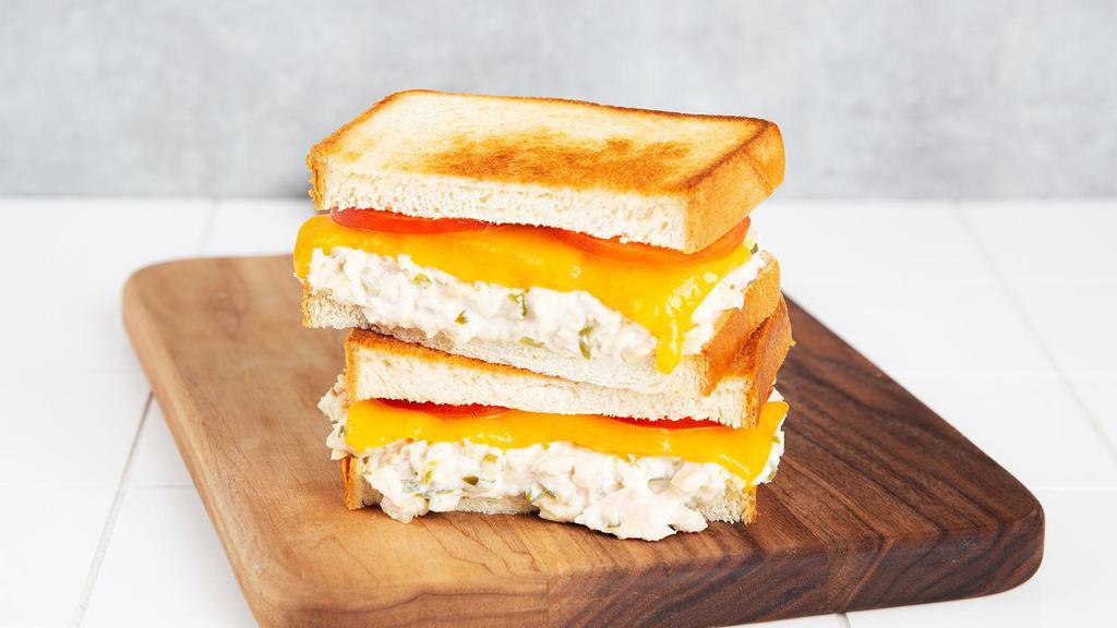 Tuna Melt · Griddled sandwich with tuna salad, melted yellow cheddar, tomato, and your choice of bread.
