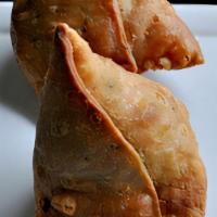 Samosa Chane (2 Pieces) · A samosa is a fried or baked pastry with a savory filling, including ingredients such as spi...