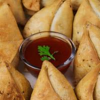 Samosa Tray (20 Pieces) · A samosa is a fried or baked pastry with a savory filling, including ingredients such as spi...