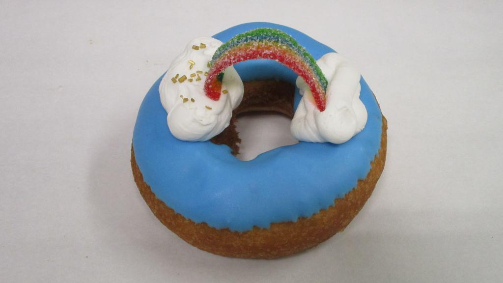 Over The Rainbow · Vanilla cake donut with vanilla icing, buttercream, and a sour gummy rainbow