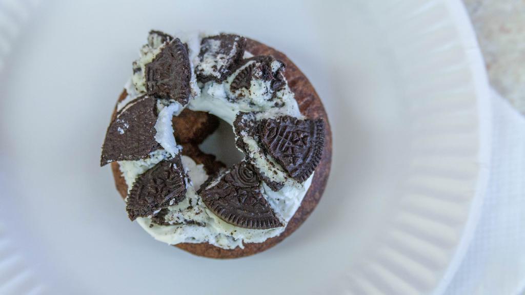 Cookies N Cream · Chocolate cake donut with buttercream topped with crushed Oreo cookies