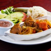 Carne Guisada · Stew beef cooked with vegetables, served with rice, refried beans, grilled jalapeno, salad a...