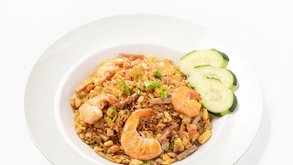 Tay Ho Fried Rice · Vietnamese ham, eggs, peas and carrots, lap xuong sausage, shrimp, garlic, green onions, and a fried egg